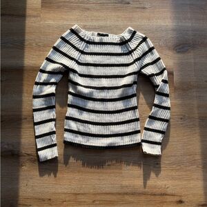 The limited off the shoulder cream white and black sweater